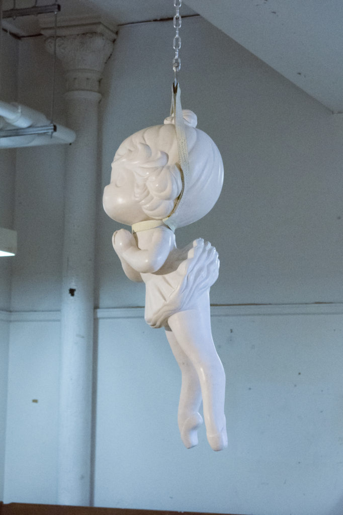 Melanie Vote sculpture: Found, 2011, resin, strap & chain, 20x20x60 in.